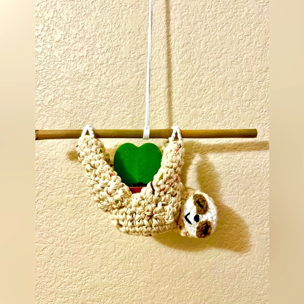 Sloth planter hanging from a bamboo stick crochet pattern